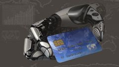 A robotic arm holding a debit card