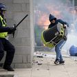 Riot police clash with anti-migration protesters outside of the Holiday Inn Express in Manvers, which is being used as an asylum hotel, on August 4, 2024 in Rotherham, United Kingdom