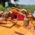 Two people enjoying burgers
