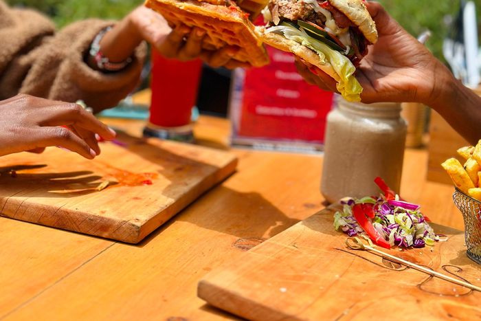 Two people enjoying burgers