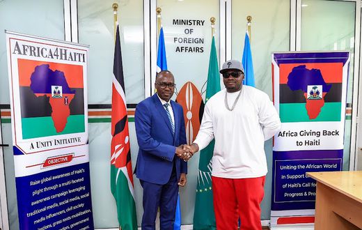 File image of Foreign Affairs Principal Secretary Dr. Korir Sing’oei with Khaligraph Jones who will be headlining the ‘Harmony for Haiti’ concert