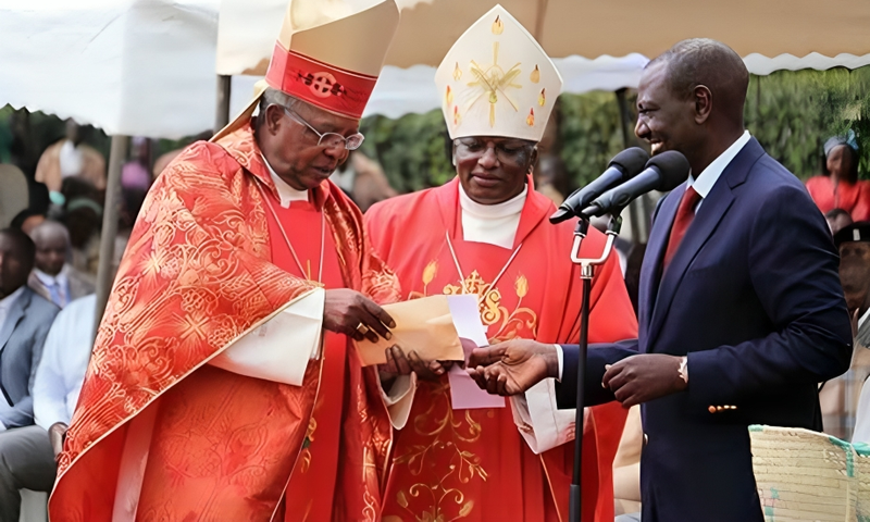 William Ruto receives a donation from John Cardinal Njue (left) during a fundraiser at St Thomas Moore Kairuri Catholic Parish on July 1, 2018