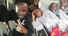 A past image of Singer Bahati with Morgan Bahati, Purity and Rose when they were still young