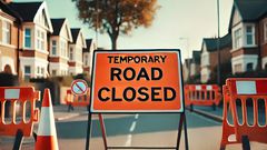 A road closed sign on a suburban street