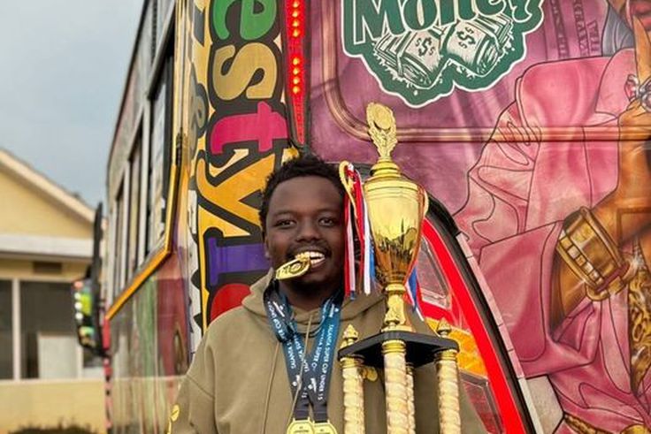 George Ruto poses with the trophy after the U15s Talanta Super Cup in Eldoret