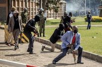 Police officers and security personnel take position to protect Parliament during Finance Bill 2024 protests in Nairobi, on June 25, 2024.