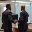 An AI generated image showing two black men exchanging a briefcase in an office