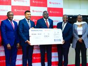 The PS Transport Mohammed Daghar cuts a ribbon to launch a KQ ticketing office at KICC. Looking on is KICC CEO James Mwaura, Principle Administrative secretary Public service Authur Osiya, KQ CEO Allan Kivaluka