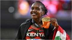 Faith Kipyegon shows off her Gold Medal during a past competition