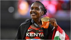 Faith Kipyegon shows off her Gold Medal during a past competition