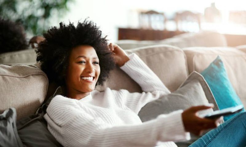 A person watching TV