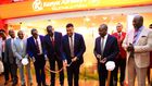 The PS Transport Mohammed Daghar cuts a ribbon to launch a KQ ticketing office at KICC. Looking on is KICC CEO James Mwaura, Principle Administrative secretary Public service Authur Osiya, KQ CEO Allan Kivaluka