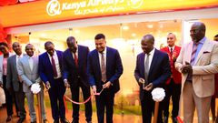 The PS Transport Mohammed Daghar cuts a ribbon to launch a KQ ticketing office at KICC. Looking on is KICC CEO James Mwaura, Principle Administrative secretary Public service Authur Osiya, KQ CEO Allan Kivaluka