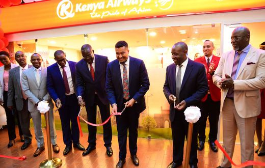 The PS Transport Mohammed Daghar cuts a ribbon to launch a KQ ticketing office at KICC. Looking on is KICC CEO James Mwaura, Principle Administrative secretary Public service Authur Osiya, KQ CEO Allan Kivaluka