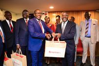 The PS Transport Mohammed Daghar cuts a ribbon to launch a KQ ticketing office at KICC. Looking on is KICC CEO James Mwaura, Principle Administrative secretary Public service Authur Osiya, KQ CEO Allan Kivaluka