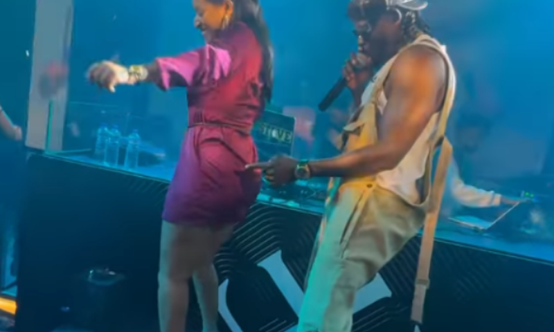 Arrow Bwoy dancing with a fan during show in Ethiopia