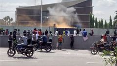 Protesters set fire to the gate of the Belgian embassy in Kinshasa on Tuesday