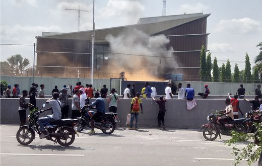 Protesters set fire to the gate of the Belgian embassy in Kinshasa on Tuesday