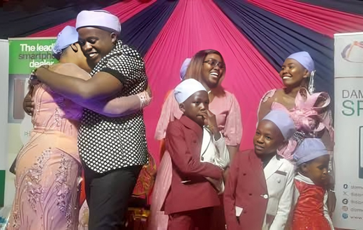Karangu Muraya hugging his wife Trizah