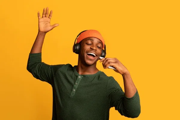 A man listening to music through headphones