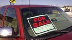 A 'for sale' sign on a car