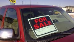 A 'for sale' sign on a car