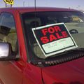 A 'for sale' sign on a car