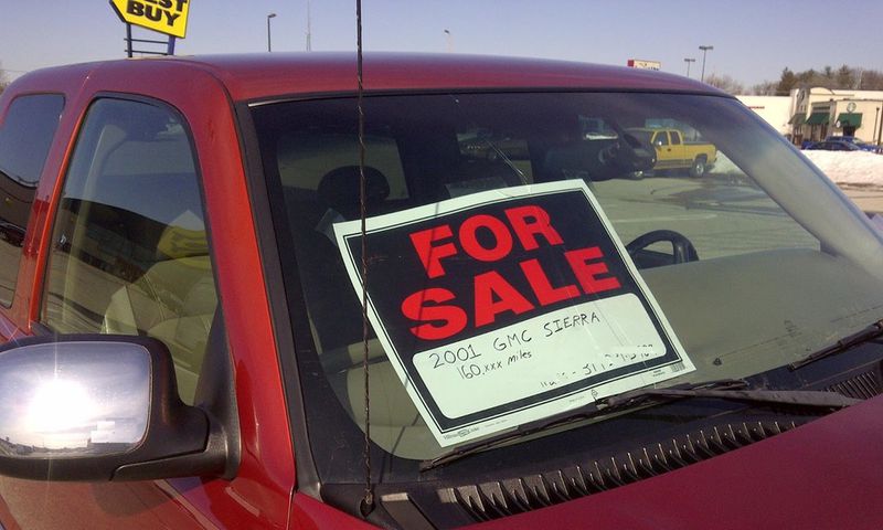 A 'for sale' sign on a car