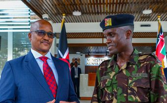 Chief of the Defence Forces (CDF) General Charles Kahariri with Corporal Boniface Muchiri