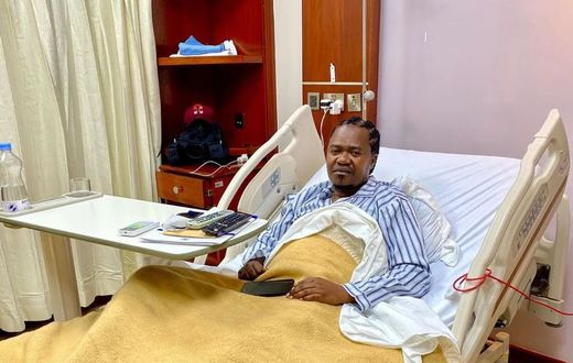 Singer Jua Cali in a hospital bed