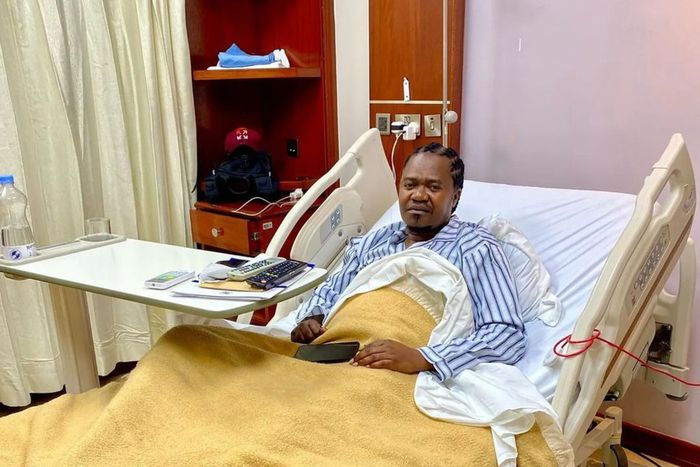 Singer Jua Cali in a hospital bed