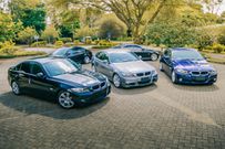 A file image of high end cars in a parking lot