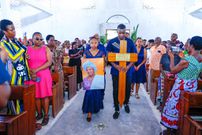 Mashirima Kapombe and her brother Eugene at the burial of their mother
