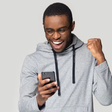 An excited man using a phone