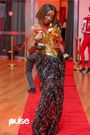 Claudia Naisabwa holds up her two Pulse Influencer Awards 2024 titles - Fashion Influencer of the Year and Best Dressed Influencer at the gala celebration on October 12, 2024