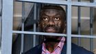 Veteran Ugandan politician, Colonel (Rtd) Dr Kizza Besigye, behind bars at the General Court Martial at Makindye, Kampala on November 20, 2024