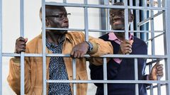 Veteran Ugandan politician, Colonel (Rtd) Dr Kizza Besigye (right) appears in Martial Court alongside his aide Obeid Lutale (left)