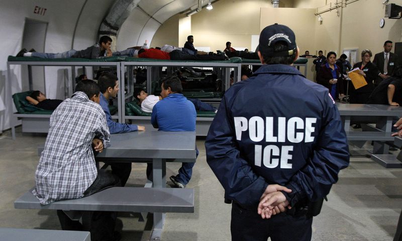 A group of undocumented immigrants awaiting deportation.