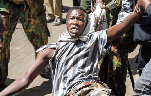 Allans Ademba being apprehended by police during the June 25 anti-finance bill protests