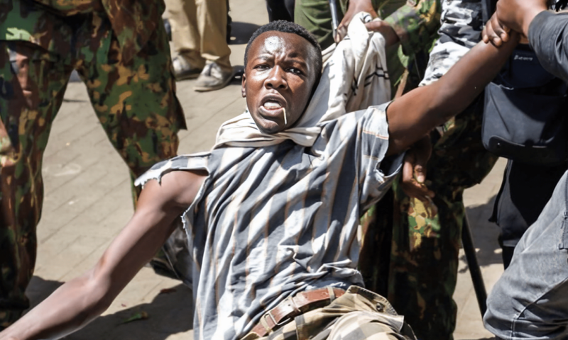 Allans Ademba being apprehended by police during the June 25 anti-finance bill protests