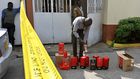 A Kenya Revenue Authority (KRA) official inspects packages of liquor that were seized on January 8, 2019 at a residential estate in Nairobi. Photo credit: Tony Karumba /AFP via Getty Images
