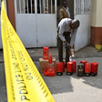 A Kenya Revenue Authority (KRA) official inspects packages of liquor that were seized on January 8, 2019 at a residential estate in Nairobi. Photo credit: Tony Karumba /AFP via Getty Images