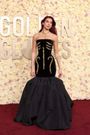 Dua Lipa wore a black dress covered in gold embellishments meant to look like bones.