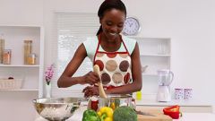 Woman cooking(Framepool & RightSmith Stock Footage)
