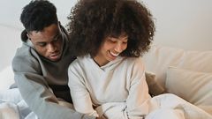 Couple playing with their pet