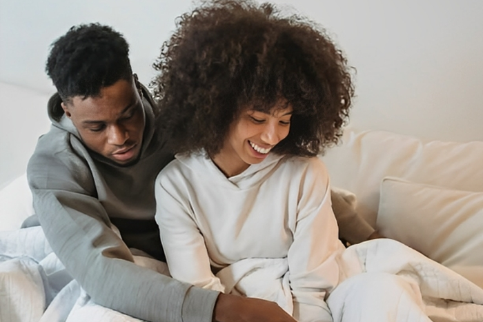 Couple playing with their pet