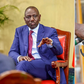 A collage of  President William Ruto and a fuel pump