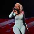 Cardi B has come under heat for throwing the mic — the woman hit by it later filed a police report for battery.Getty/Paras Griffin