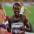Kenya's Faith Kipyegon reacts after winning the 1500m Women event at the Wanda Diamond League athletics meeting at the Louis II Stadium in Monaco on August 10, 2022. (Photo by VALERY HACHE/AFP via Getty Images)