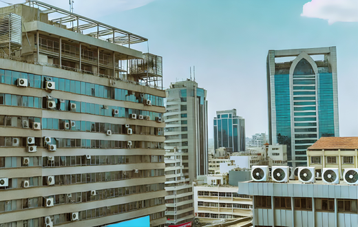 An AI-generated image of urban landscape in Nairobi, Kenya featuring modern high-rise buildings with visible air conditioning vents The scene depicts a clear sky and bustling